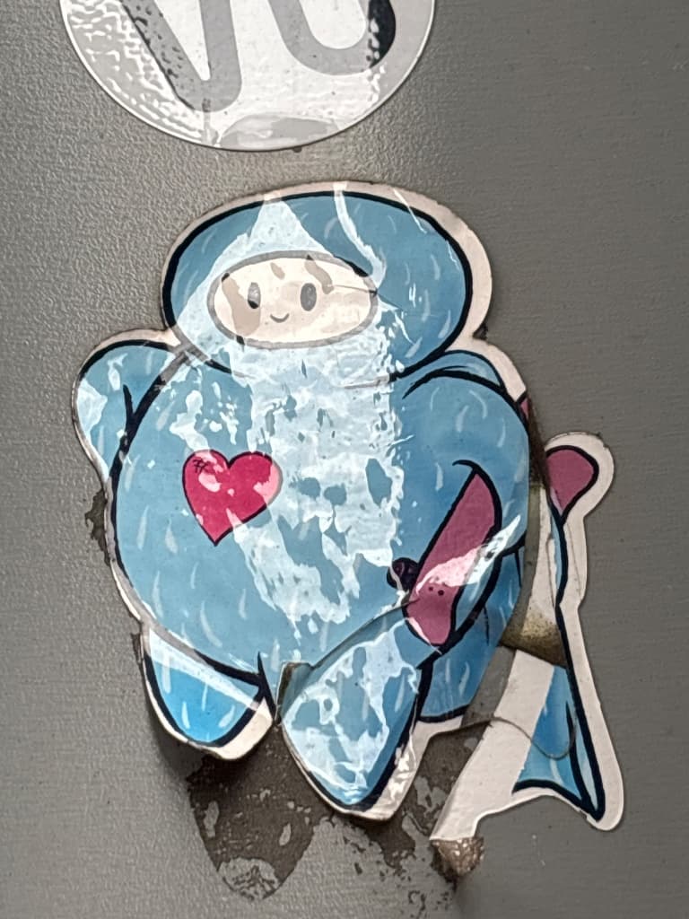 Blue space ranger with a big heart sticker in The Hague